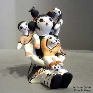 3 children, butterfly, birds, lady bug and a lizard on a grandmother storyteller