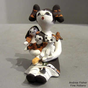 2 children, butterfly, bird, lady bugs and a kitten on a storyteller