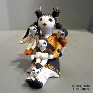 3 children, bird, kitten, butterfly and lady bug on a grandmother storyteller