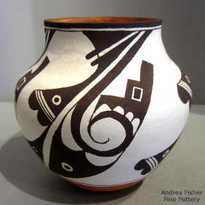 Black and white bird element and geometric design on a polychrome jar