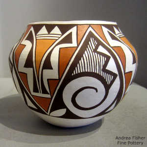 Kiva step, rain spiral and geometric design on a polychrome jar