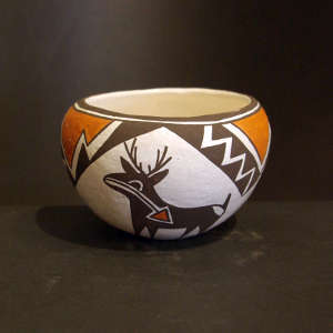 Deer, heart line, lightning and geometric design on a polychrome bowl