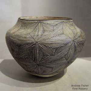 Snowflake fine line design on a black and white jar