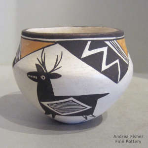 Deer, lightning bolt, rain and geometric design decorate a olychrome jar
