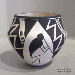 Kokopelli, lightning bolt and geometric desighn on a black and white jar