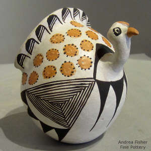 Feather and geometric design on a polychrome turkey pot