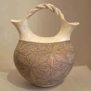 Starburst fine line design on a black and white wedding vase with a twisted handle