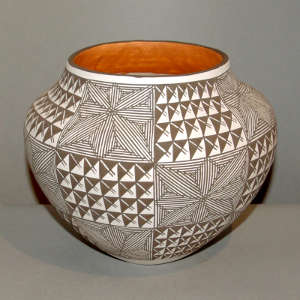 Fine line snowflake and geometric design on a black and white jar