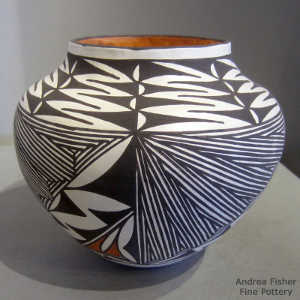 Fine line and geometric design on a polychrome jar