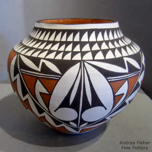 Fine line and geometric design on a polychrome jar