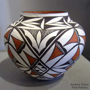 Medallion, rain and geometric design on a polychrome jar