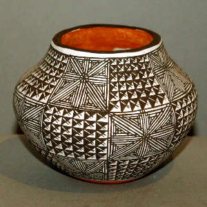 Fine line and geometric design on a polychrome jar