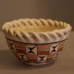 Braid rim and geometric design on a 1950's style polychrome pot