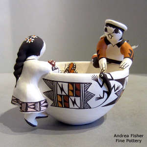 Two children, turtle, lizard and geometric design on a friendship bowl