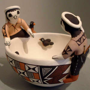 Two children, turtle, lizard and geometric design on a friendship bowl