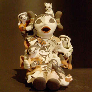 Four children, two cats and butterflies on a storyteller