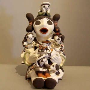 Four children, a dog and a pot on a grandmother storyteller