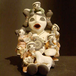 Five children, a dog, birds, lady bugs and a canteen on a grandmother storyteller