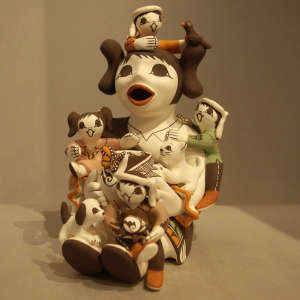 Four children with birds, cat and butterfly on a polychrome storyteller