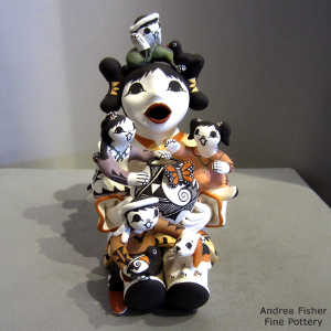 Four children, 2 birds, a butterfly and a puppy on a grandmother storyteller