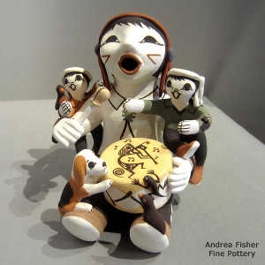 2 children, birds and a puppy on a young drummer storyteller