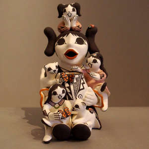 Three children and two cats on a grandmother storyteller