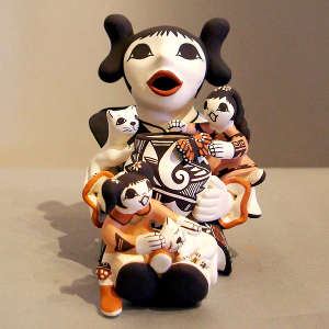 2 children and 2 cats on a grandmother storyteller