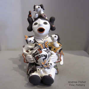 2 children on a grandmother storyteller