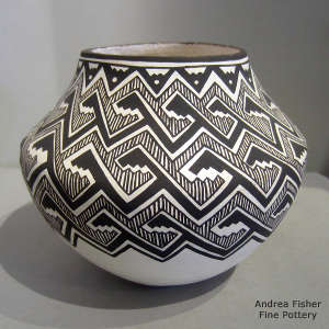 Keys and locks geometric design on a black and white jar