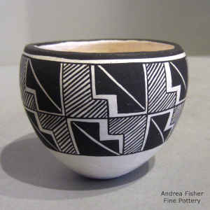 Black and white jar decorated with a kiva step, rain and geometric design