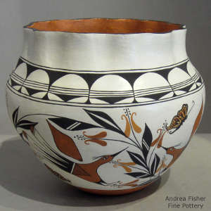 Bird, floral , butterfly and geometric design on a polychrome jar with pie crust rim