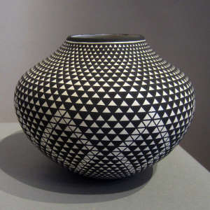 Acoma stepped geometric design on a black and white jar