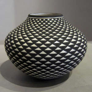 Acoma stepped design on a black and white jar