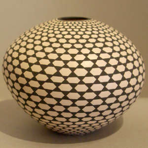 Geometric design on a black and white seed pot