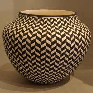 Traditional geometric design on a black and white jar