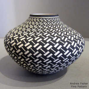 Basket weave geometric design on a black and white jar
