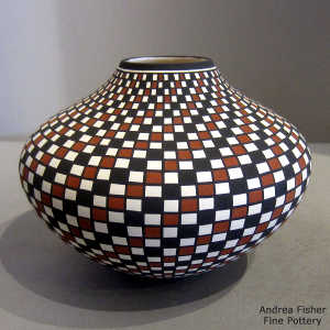 Checkerboard swirl geometric design on a polychrome jar