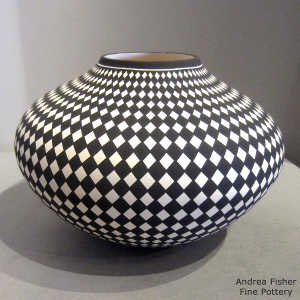 Diamond checkerboard design on a black and white jar