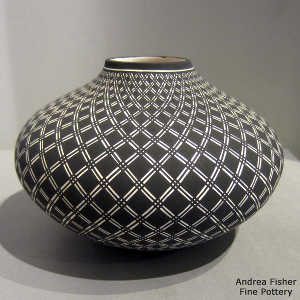 A geometric design on a black and white jar