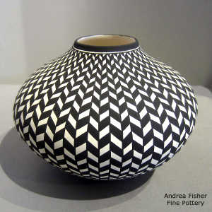 A geometric design on a black and white jar