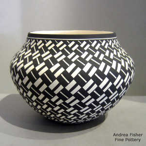 Basket weave geometric design on a black and white jar
