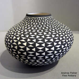 A geometric design on a black and white jar