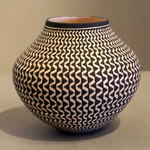 A geometric design on a black and white jar