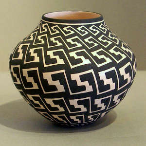 An interlocking kiva step and key geometric design on a black and white jar