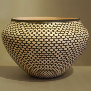 A geometric design on a black and white jar