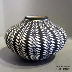 A geometric design on a black and white jar