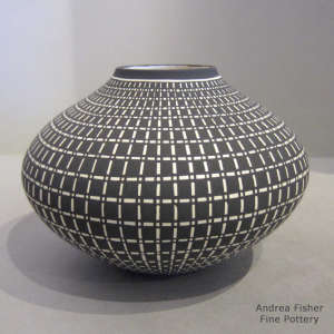 A geometric design on a black and white jar