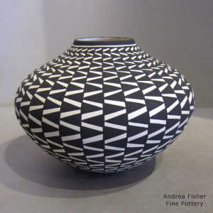 A geometric design on a black and white jar