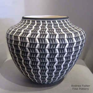A ightning bolt geometric design on a black and white jar
