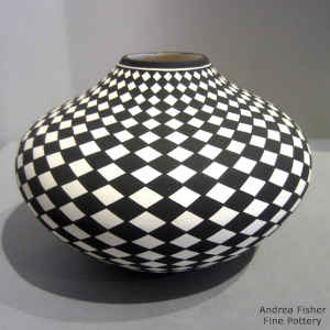 Spiral checkerboard design on a black and white jar